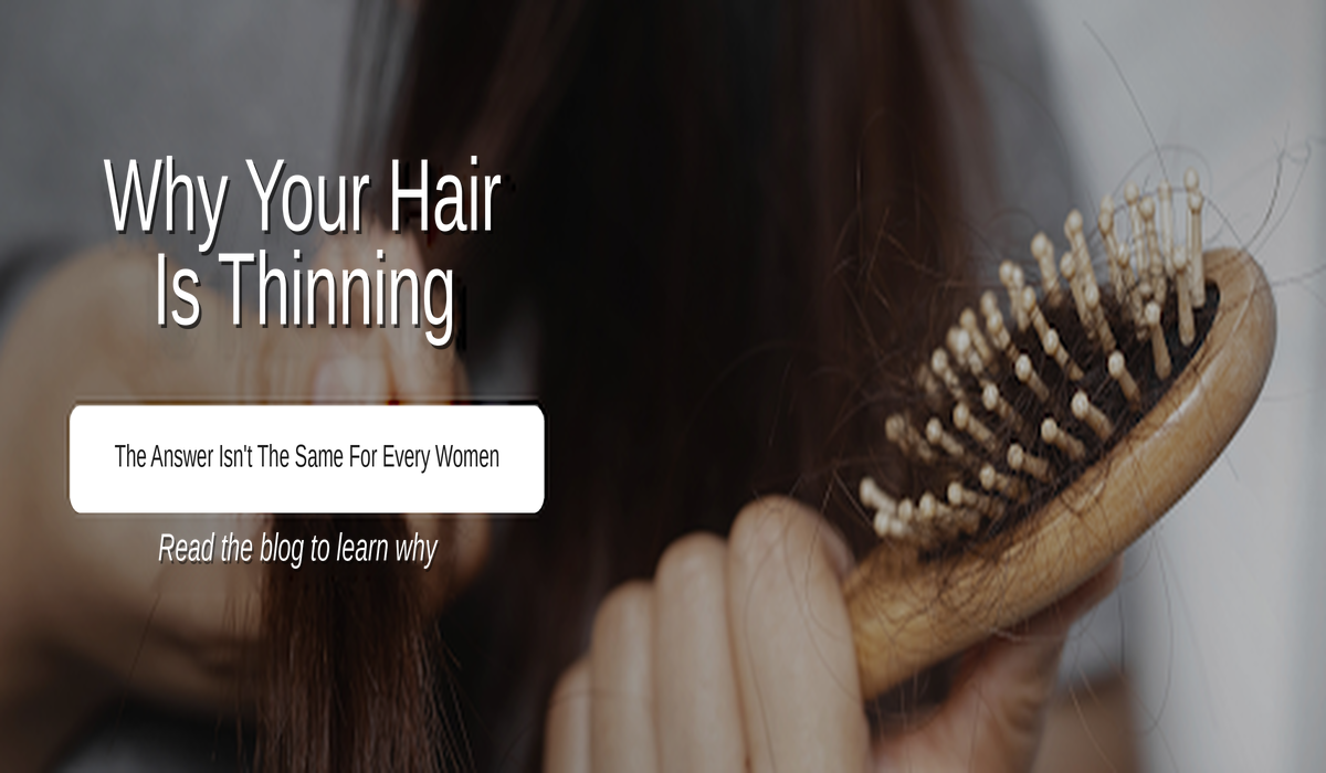 Woman examining thinning hair and a widening part in the mirror.